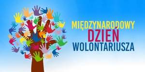 plakat z napisem Międzynarodowy Dzień Wolontariusza